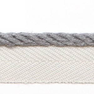 May include: Gray rope trim with a white fabric backing. The rope trim is a thick, twisted cord.