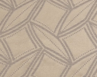May include: Beige fabric with a repeating geometric pattern of gray diamonds outlined with small gray dots.