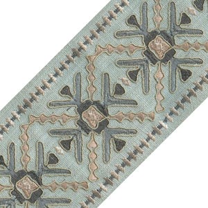 May include: A white ceramic mug with a black handle and the text "But First, Coffee" in a black, handwritten-style font. The mug is on a white surface.