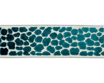 May include: Teal blue velvet ribbon with a white background and a repeating pattern of teal blue circles.