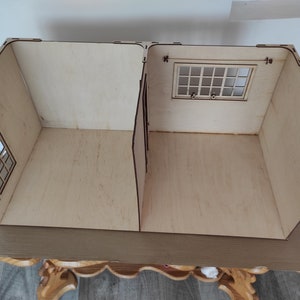 May include: Two unfinished wooden dollhouse rooms with windows. The rooms are empty and ready to be decorated.