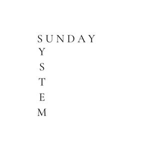 May include: A graphic design featuring the word SUNDAY written horizontally in black serif font, with the word SYSTEM written vertically in black serif font, sharing the letter Y at the intersection point, all displayed against a plain white background.