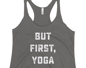 May include: Gray tank top with the text "BUT FIRST, YOGA" in white.