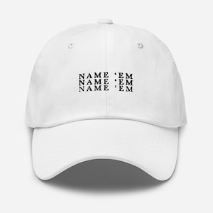 May include: White baseball cap with black text that reads "NAME 'EM" repeated three times.
