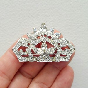 1980s Art Deco Revival Large Rhinestone Crown shaped silvertone brooch, 1928 jewelry company brand.
