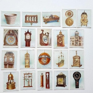 May include: A collection of 20 vintage Player's Cigarettes cards featuring various types of clocks. The cards are white with blue borders and feature illustrations of clocks in different styles, including a grandfather clock, a cuckoo clock, and a clock tower.