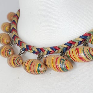 Unsigned Miriam Haskell style painted wood dangle choker necklace,  late Art Deco period 1930s-1940s, football shaped, woven satin cord.