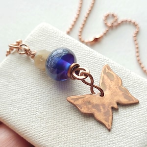 Copper butterfly pendant necklace, with handmade blue purple lampwork glass and jadite flower, 22&quot; copper ball chain.