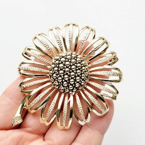 Mod Vintage Sarah Coventry large goldtone flower brooch, raised dome, signed, 2-1/2&quot;.