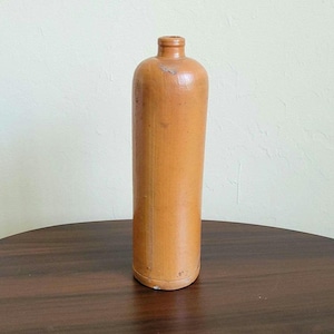 Tall cylinder glazed stoneware bottle stamped N2, early vintage, rustic French style pottery decor.