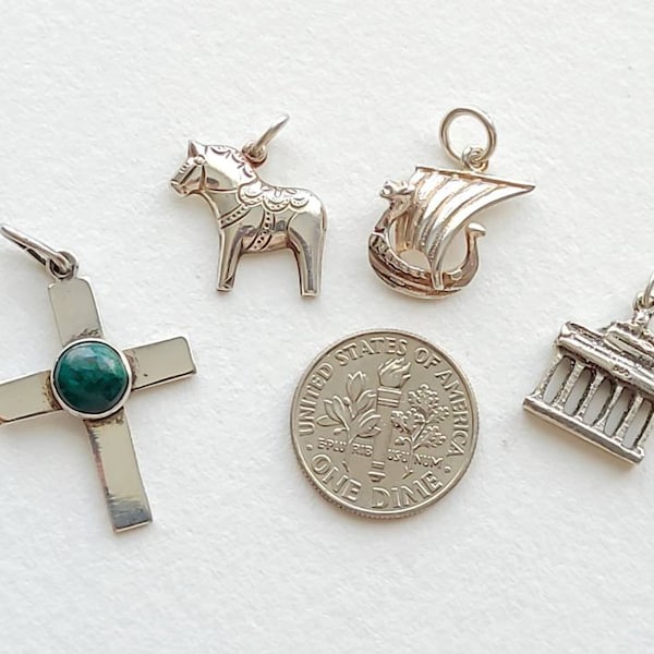 Vintage tiny silver charm pendants, Israel cross, Swedish dala horse, Norwegian viking ship, Germany Brandenburg Gate, priced individually.