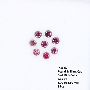 May include: Eight round brilliant cut dark pink diamonds, each measuring 2.10 to 2.30 mm and weighing 0.35 carats total. JK264(2)