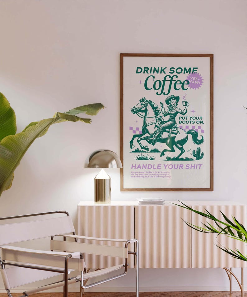 Cowgirl-inspired wall art print that says “Drink Some Coffee, Put Your Boots On, Handle Your Sh*t,” styled for a modern coffee bar or kitchen coffee station with a warm western vibe and motivational decor.