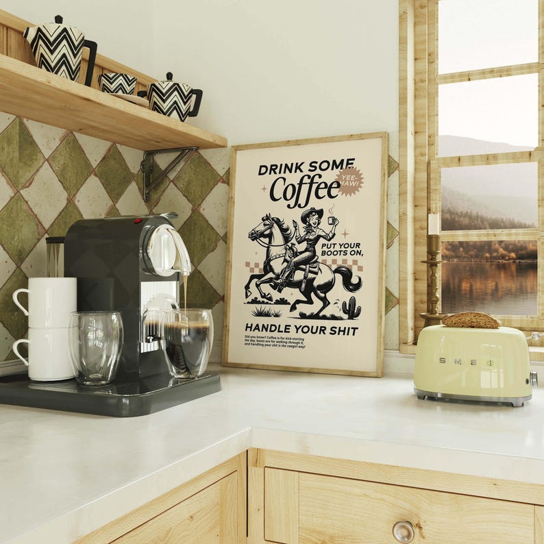Cowgirl-inspired wall art print that says “Drink Some Coffee, Put Your Boots On, Handle Your Sh*t,” styled for a modern coffee bar or kitchen coffee station with a warm western vibe and motivational decor.