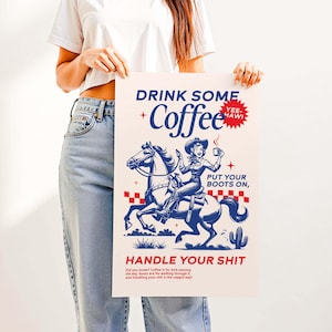 Cowgirl-inspired wall art print that says “Drink Some Coffee, Put Your Boots On, Handle Your Sh*t,” styled for a modern coffee bar or kitchen coffee station with a warm western vibe and motivational decor.