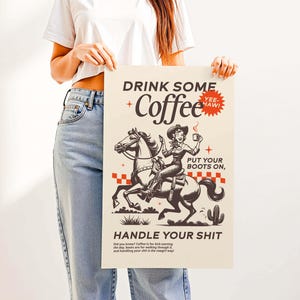 Cowgirl-inspired wall art print that says “Drink Some Coffee, Put Your Boots On, Handle Your Sh*t,” styled for a modern coffee bar or kitchen coffee station with a warm western vibe and motivational decor.