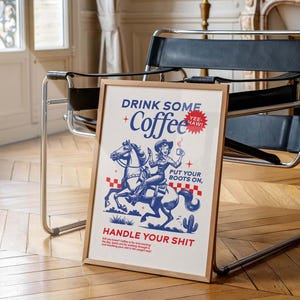 Cowgirl-inspired wall art print that says “Drink Some Coffee, Put Your Boots On, Handle Your Sh*t,” styled for a modern coffee bar or kitchen coffee station with a warm western vibe and motivational decor.
