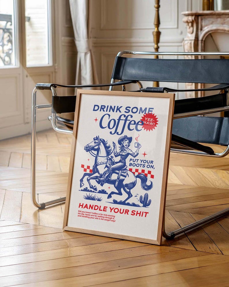 Cowgirl-inspired wall art print that says “Drink Some Coffee, Put Your Boots On, Handle Your Sh*t,” styled for a modern coffee bar or kitchen coffee station with a warm western vibe and motivational decor.