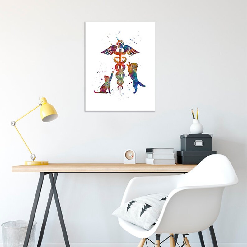 May include: A watercolor painting of a veterinary symbol with a cat and dog on either side. The symbol is a caduceus with wings and a paw print at the top. The background is white with watercolor splatters.