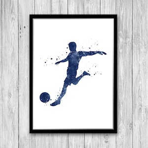 May include: A watercolor painting of a soccer player kicking a ball. The player is in a blue silhouette with white splatters of paint around them. The background is white.
