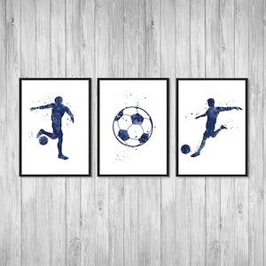 May include: Three framed prints with a blue watercolor design of a soccer player and a soccer ball. The prints are on a white background with black frames.