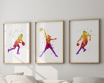May include: Three watercolor paintings of basketball players in action. Each painting features a different player in a dynamic pose, with splashes of color creating a vibrant and energetic effect.