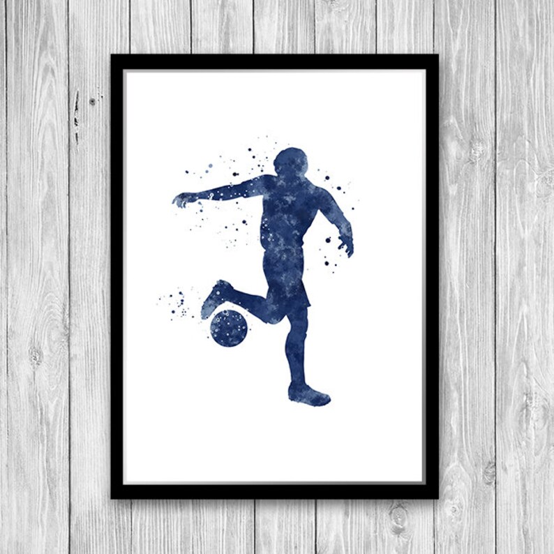 May include: A watercolor painting of a soccer player in blue, kicking a ball. The player is silhouetted against a white background with blue watercolor splatters.