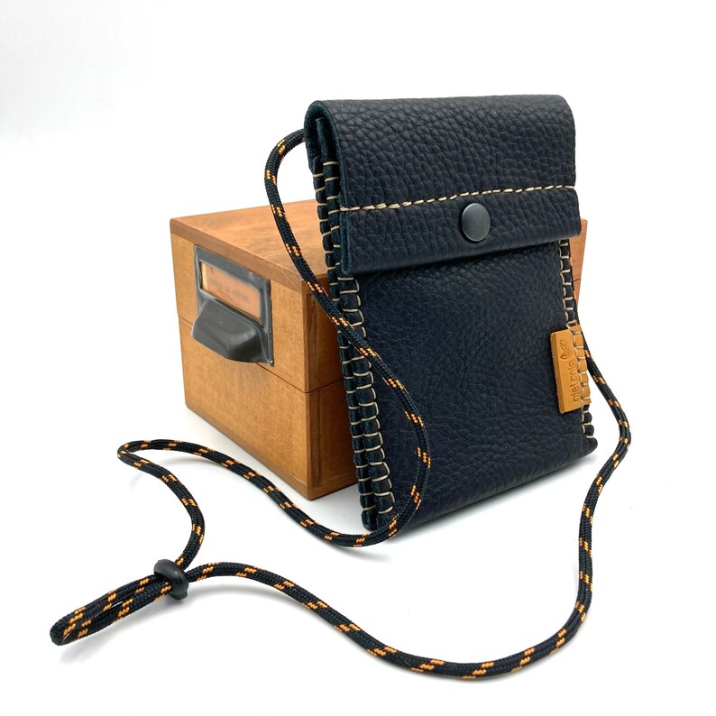 Black leather travel neck wallet.