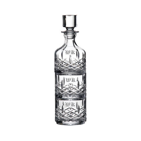 A Waterford crystal decanter set with custom engraving — the kind of heirloom barware that actually gets displayed on a sideboard rather than hidden in a cabinet.