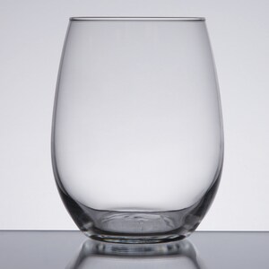 May include: A clear glass wine glass with a rounded base and a wide, open mouth.