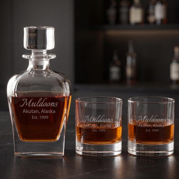 Lenox crystal decanter set custom-engraved with a name or monogram — the kind of weighty, heirloom-feeling barware gift that actually earns shelf space.