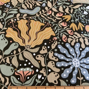May include: Black fabric with a repeating pattern of stylized flowers, leaves, and mushrooms in shades of brown, beige, pink, blue, and white.