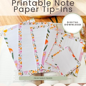 May include: Printable note paper tip-ins with floral borders in pink, orange, and green. The image shows several white paper sheets with decorative edges, and the text "Printable Note Paper Tip-Ins" is displayed at the top. A digital download is available.