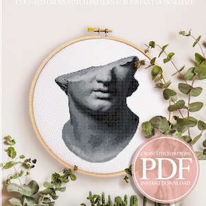 Peut inclure: Un modèle de point de croix compté pour une sculpture de buste, avec une image en noir et blanc d'une sculpture classique. Le modèle est pour un tissu Aida de 14 points et mesure 19,6 x 24,4 cm ou 108 x 134 points. Le modèle utilise 10 couleurs de fil DMC.