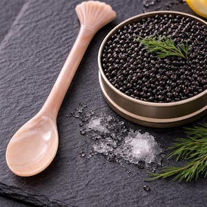 May include: A set of three ceramic mugs with a speckled, matte finish. The mugs are in shades of cream, light gray, and dark gray. Each mug has a simple, minimalist design and a rounded handle.