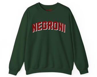 May include: A dark green sweatshirt with the word "NEGRONI" in large, red, block letters outlined in white across the chest. The sweatshirt has long sleeves and a crew neck.
