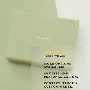 May include: A rectangular sage green gift box with the text Our Wedding printed in a light colour on the lid. The box features a smooth, matte finish and a clean, minimalist design suitable for holding jewellery or small keepsakes for a wedding event.
