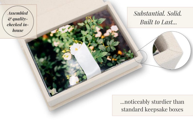 May include: A rectangular off-white keepsake box containing a stack of photographs featuring white flowers and green foliage, secured with a white paper band. Text on the image reads: Assembled & quality-checked in-house, Substantial. Solid. Built to Last... ...noticeably sturdier than standard keepsake boxes.
