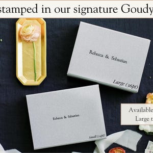 May include: Two rectangular light gray boxes featuring foil stamped text reading Rebecca & Sebastian. One box is labeled Large (36pt) and the other Small (24pt). The text reads Foil stamped in our signature Goudy font and Available in Small or Large text sizing.