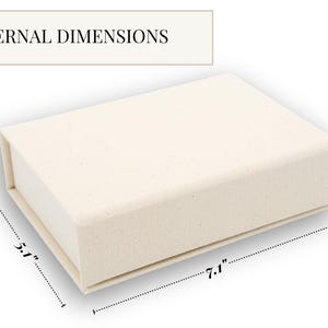 May include: A rectangular off-white box with a textured surface. The text EXTERNAL DIMENSIONS is visible at the top. The box features labeled measurements of 7.1 inches in length, 5.1 inches in width, and 2.0 inches in height.