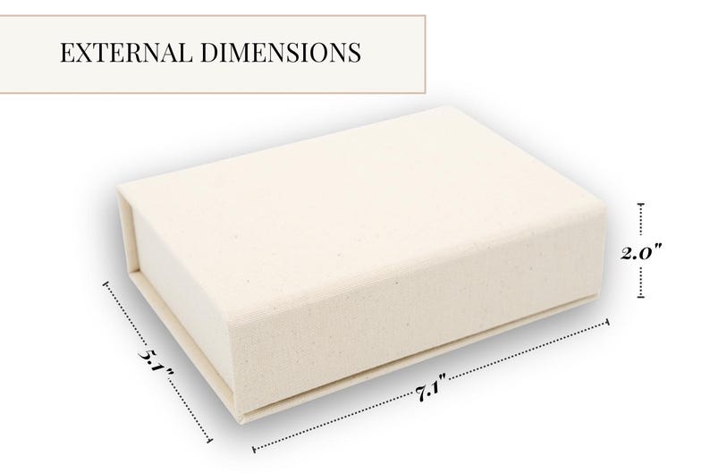 May include: A rectangular off-white box with a textured surface. The text EXTERNAL DIMENSIONS is visible at the top. The box features labeled measurements of 7.1 inches in length, 5.1 inches in width, and 2.0 inches in height.