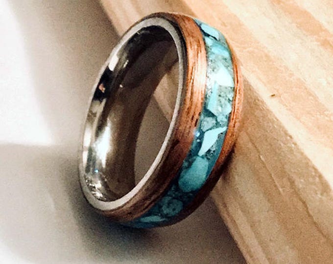 Hawaiian Koa wood ring with a turquoise inlay and a stainless steel core