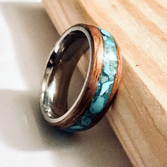 Hawaiian Koa wood ring with a turquoise inlay and a stainless steel core