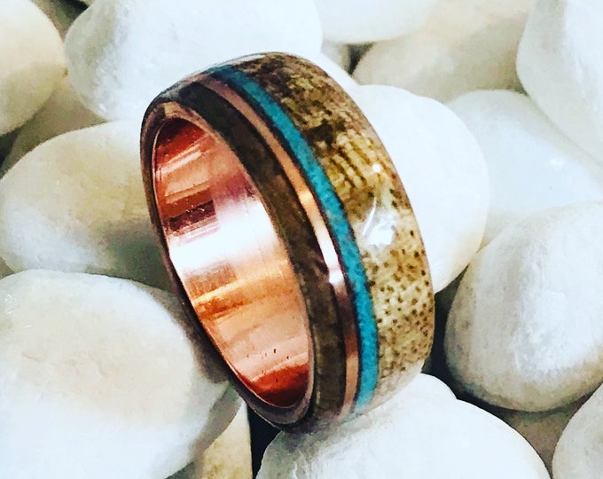 Hawaiian Koa wood ring with crushed Turquoise and copper Inlays and a copper band.