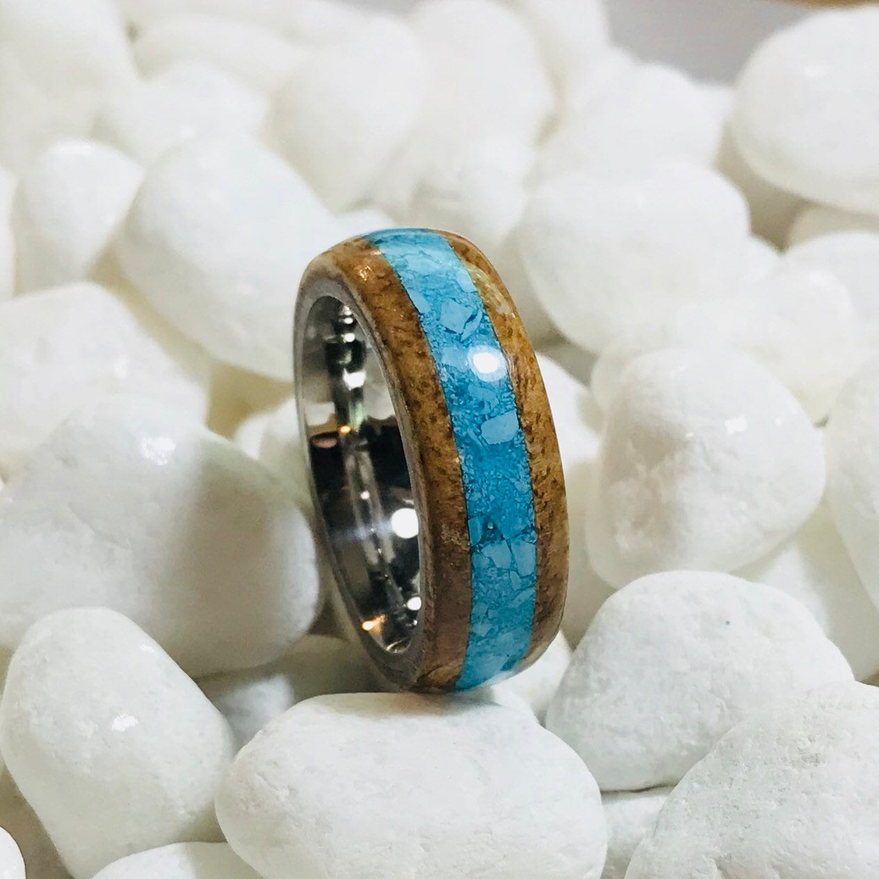 Hawaiian Koa wood ring with a turquoise inlay and a stainless steel core