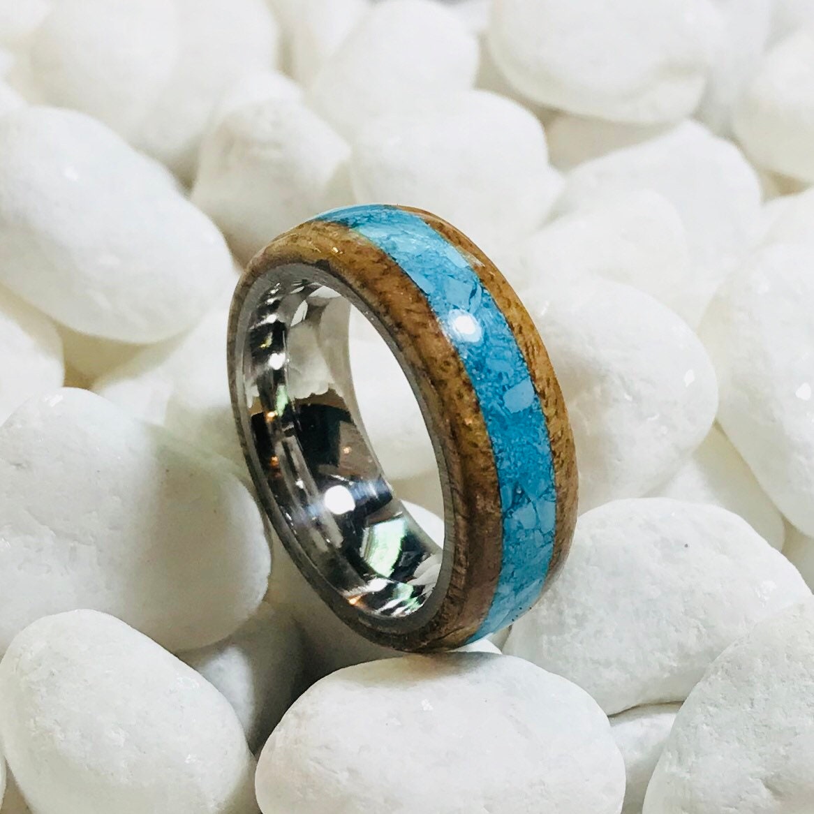 Hawaiian Koa wood ring with a turquoise inlay and a stainless steel core