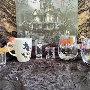 Halloween shot glasses, coffee mugs, and wine glasses