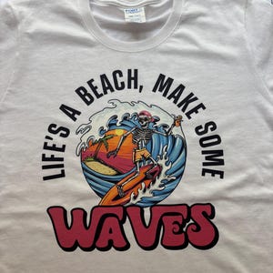 Life’s a Beach Skeleton Surf Tee Shirt – Make Some Waves