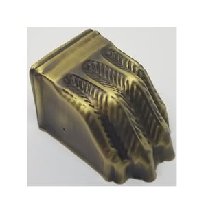 May include: A gold-toned metal furniture leg with a claw design. The leg is designed to be attached to the bottom of a piece of furniture.