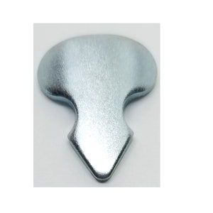 May include: A silver metal key blank with a unique shape, featuring a rounded top and a pointed bottom.